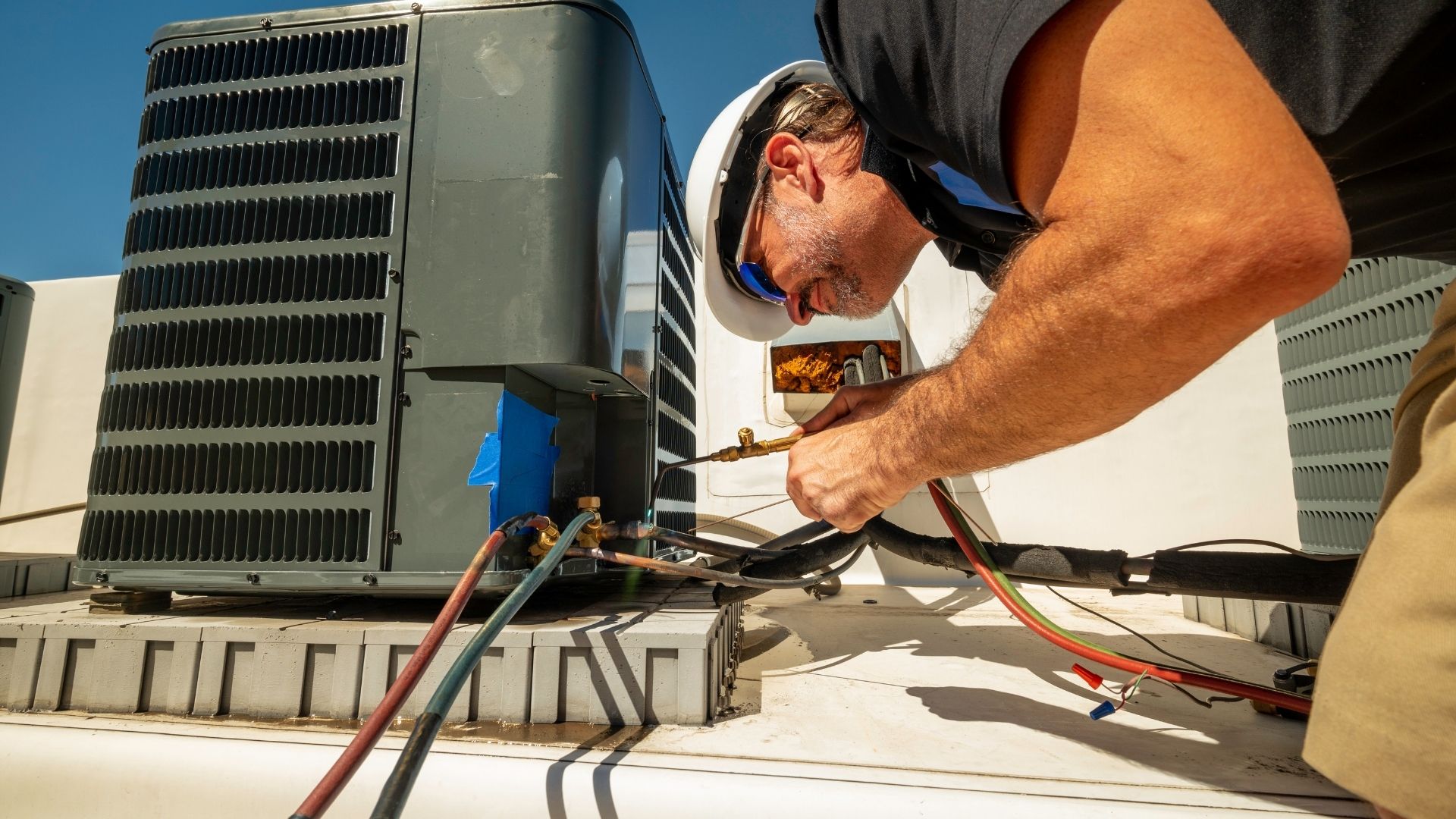HVAC service technician on installation project